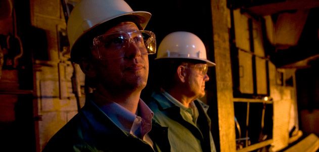 The Castens inside the furnace room at West Virginia Alloy.