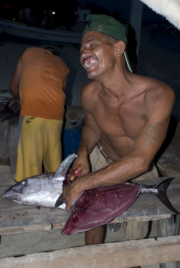 Nice Fisherman cleaning fish at Los Roques, Venezuela thumbnail