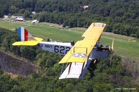 A Curtiss JN-4H chugs over Old Rhinebeck Aerodrome, one of the few sites where you can see World War I replicas fly. 