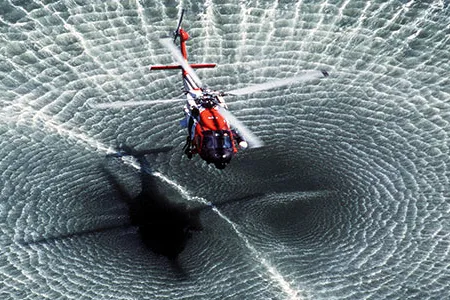 The rugged and reliable Sikorsky HH-60 Jayhawk, here in a demonstration near Yorktown, Virginia, is the Coast Guard’s only medium-range search-and-rescue helicopter. It can loiter over a target for 45 minutes, and bring back six survivors.