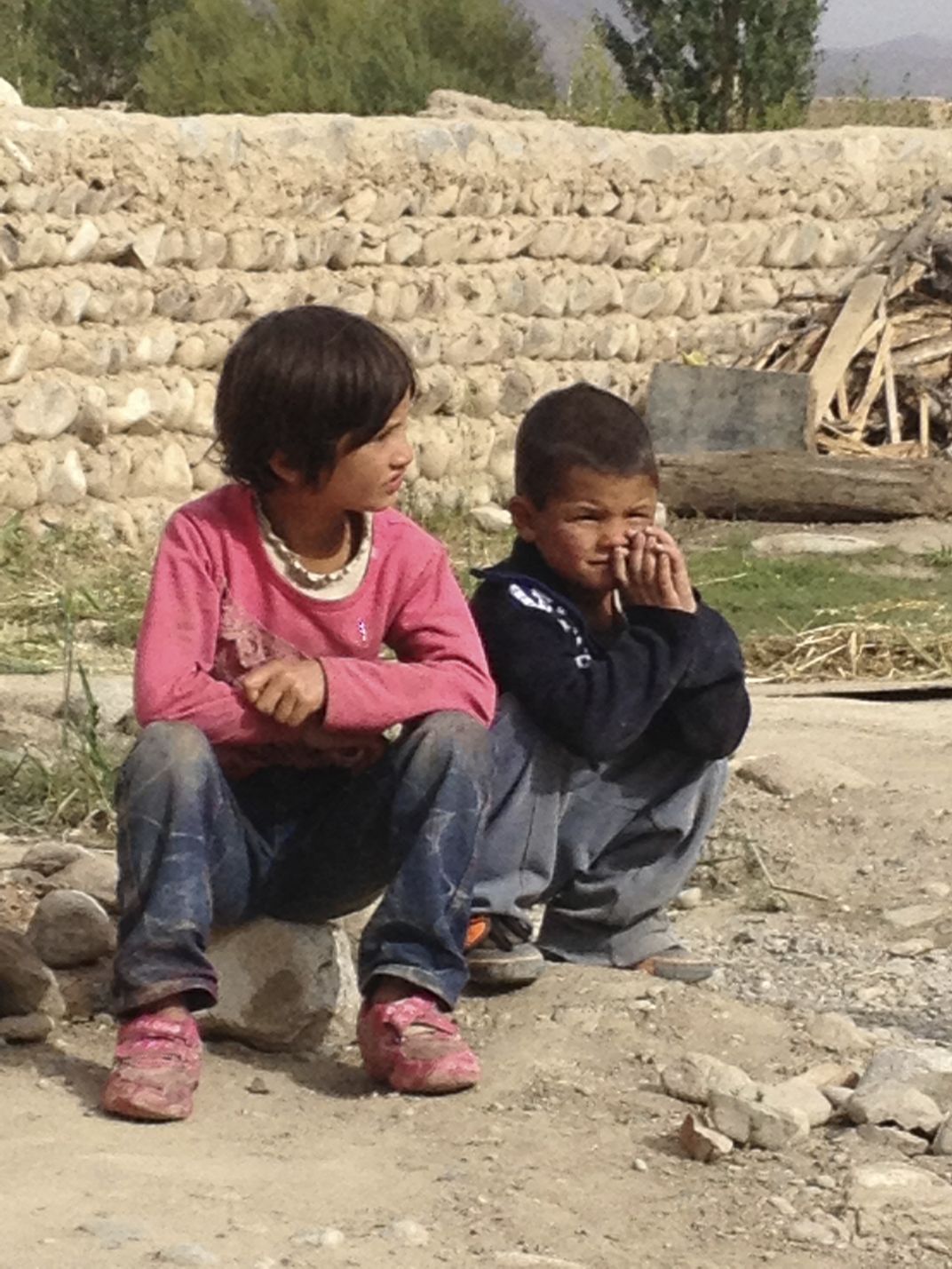 Tajik children watching people perform the traditional Eagle dance ...