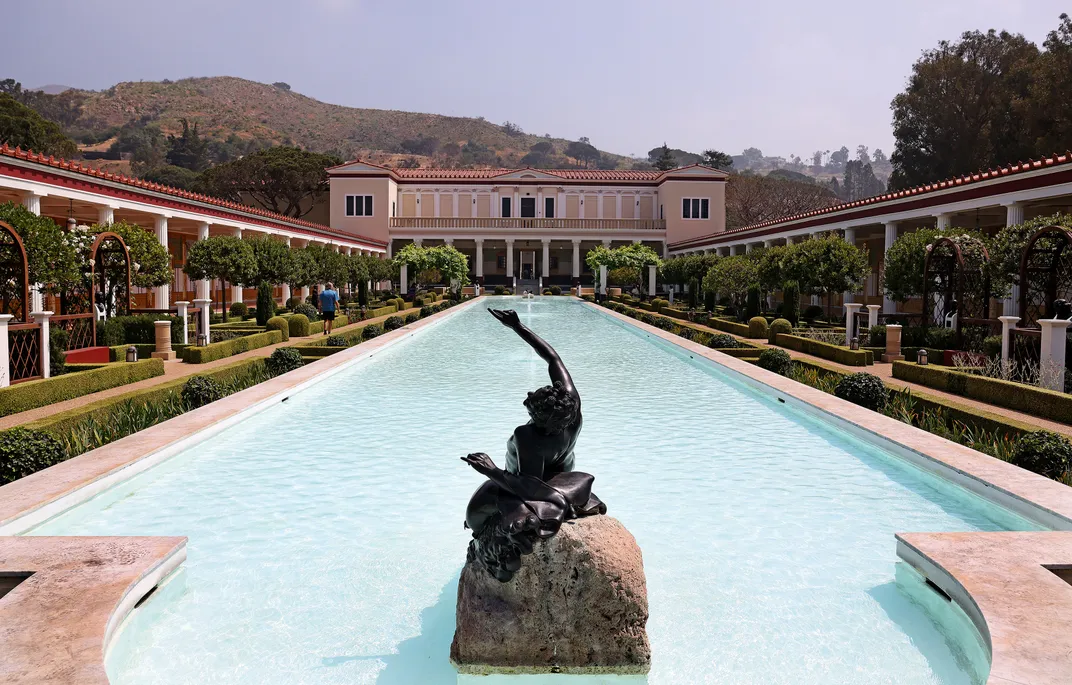 Pool of water with statue in front
