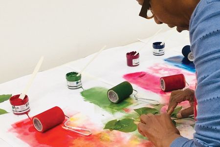 A student learns how to turn spring foliage into botanical watercolors and prints on paper in the Smithsonian Associates studio arts class, Painting and Printing: Leaves Two Ways. (Sue Fierston)