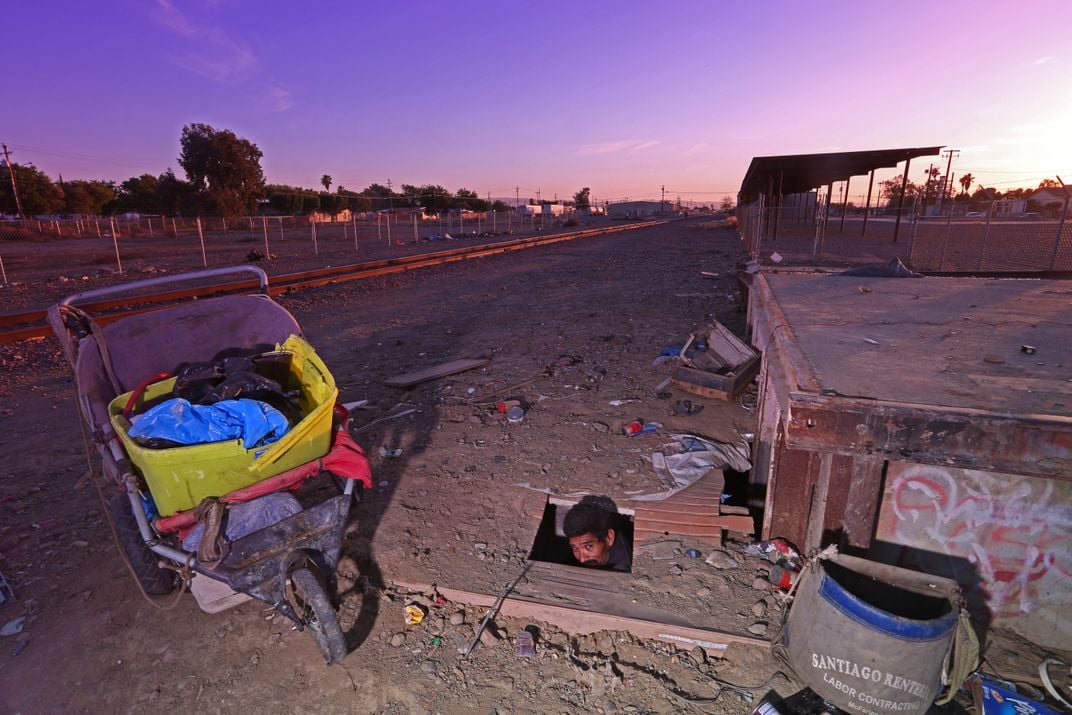 Man living in hole in the ground | Smithsonian Photo Contest ...