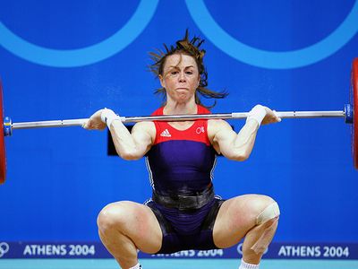 Tara Nott Cunningham attempts a snatch during the 2004 Olympic Games in Athens.
