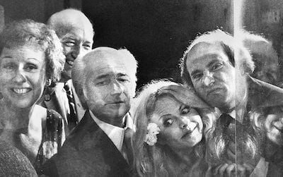 The cast of the popular television show goofs off at a donation ceremony in 1978, which added Archie and Edith Bunker’s chairs to the “A Nation of Nations” exhibit. (L-R): Jean Stapleton, Secretary (1964-1984) S. Dillon Ripley, Norman Lear, Sally Struthers and Rob Reiner as they peer into the case where the chairs are displayed. View Full Record for 92-1711.