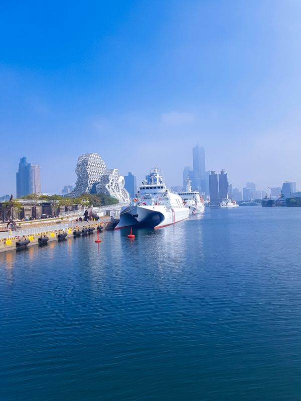 Taiwan Coast Guard Ships in the harbour with foggy Kaohsiung city landscape thumbnail