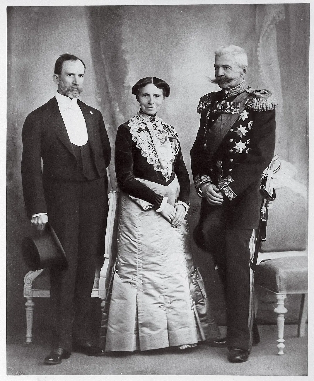 a portrait of Clara Barton with two men