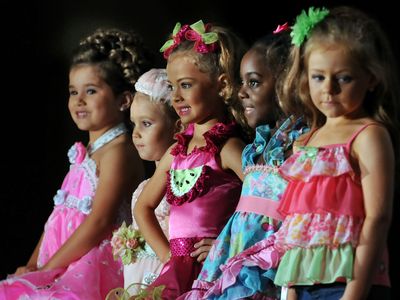 The top five contestants in the 4–6-year-old section wait on the judges' final decisions during the Little Miss Perfect competition at Renaissance Montgomery Hotel and Spa at the Convention Center in Montgomery, Alabama.
