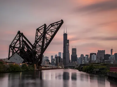 Built in 1917-1919, the St. Charles Air Line Bridge is one of the oldest in Chicago and has been designated a city landmark. It&rsquo;s still in use for freight and cargo trains, and it lifts for boats and ships passing underneath.