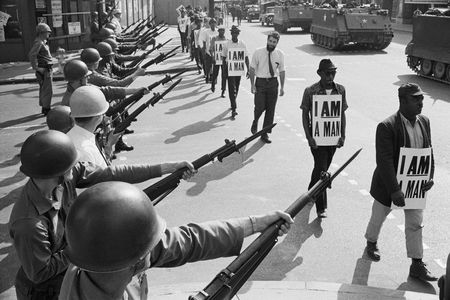 National Guard troops lined Beale Street during a protest on March 29 , 1968. “I was in every march, all of ’em, with that sign: I AM A MAN,” recalls former sanitation worker Ozell Ueal.
