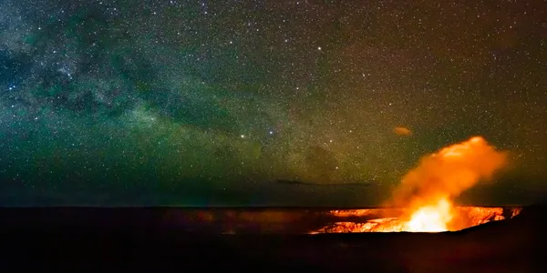 Lava in Halemaumau Crater lights up the night sky with the Milky Way thumbnail