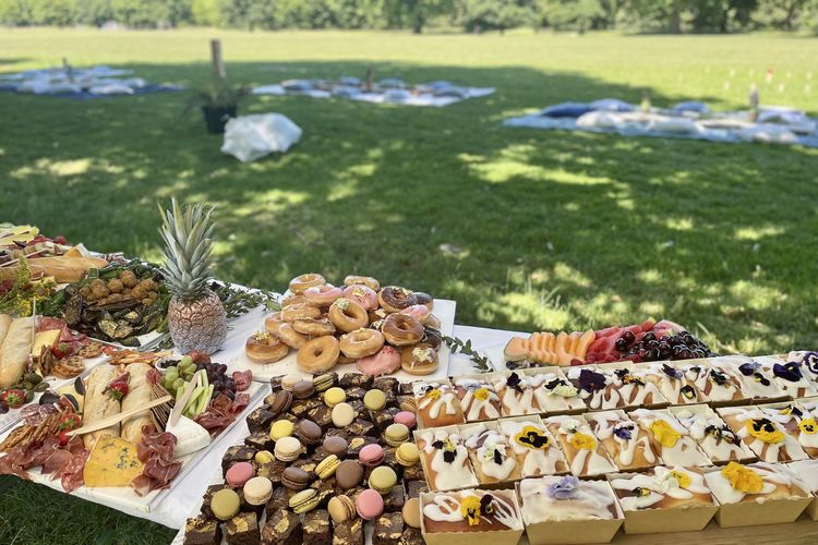 Picnic Grazing Table with picnic in background_credit The Luxury Picnic Company.jpg