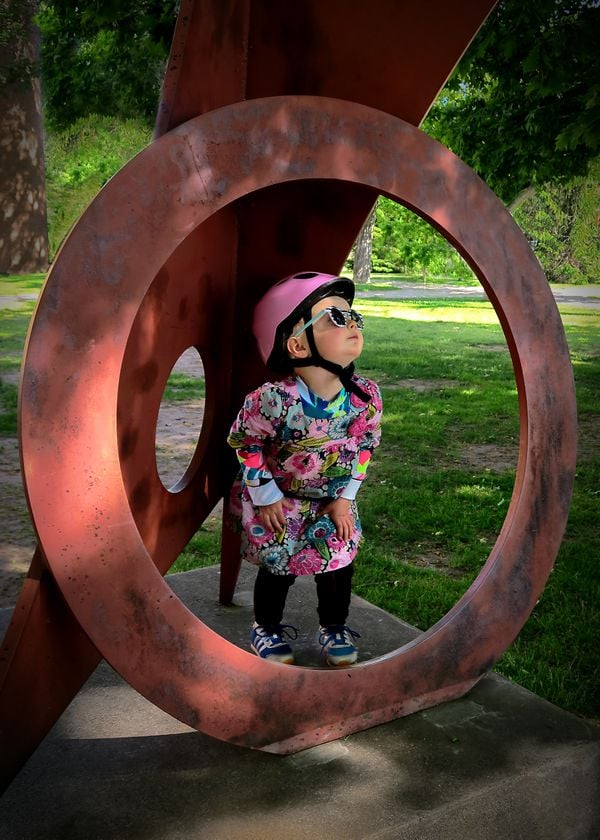 My granddaughter Ada and a modern art sculpture on the Michigan Tech campus. thumbnail