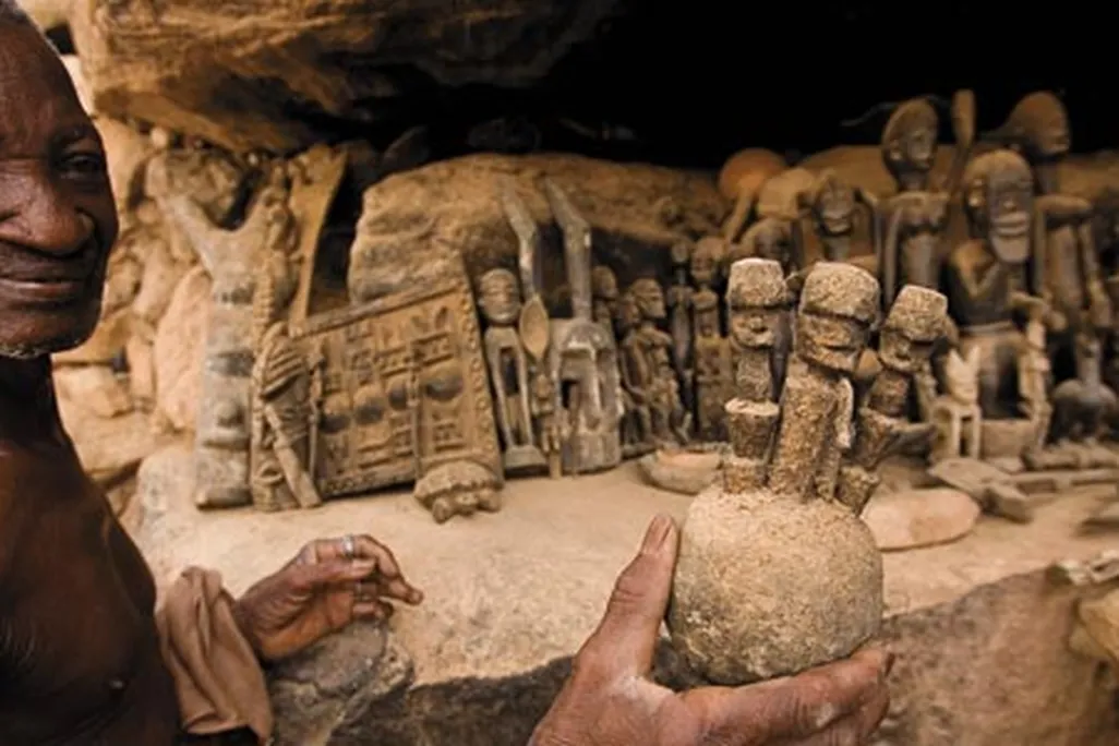 Dogon region villager with ritual figures