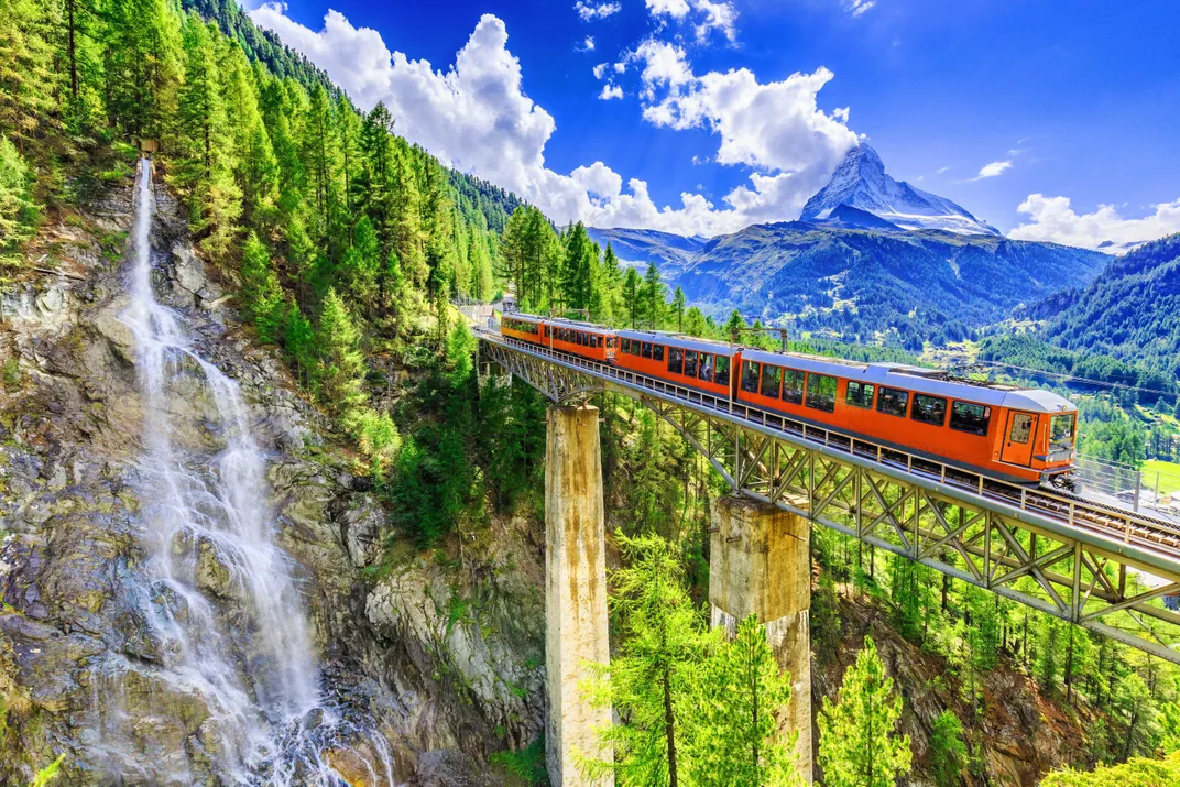 Historic Swiss train with the Matterhorn in the distance