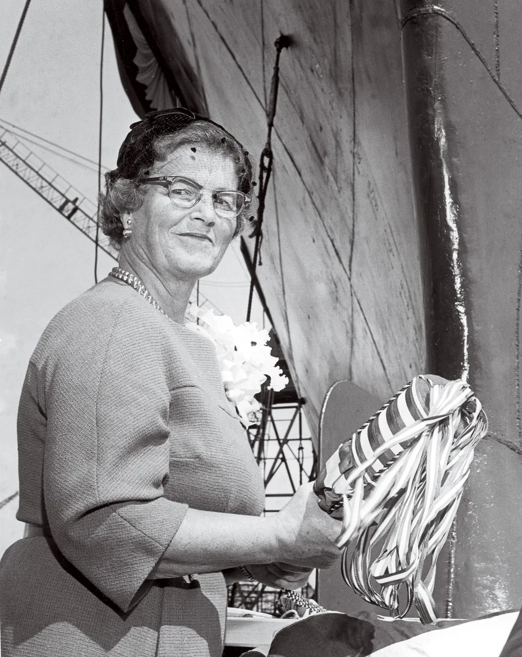 a portrait of woman at a boat christening