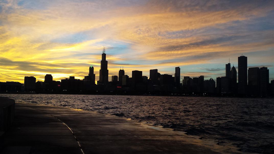 Lake shore view of Downtown Chicago at sunset | Smithsonian Photo ...