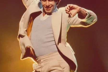 The Smithsonian’s National Portrait Gallery is home to a photograph of Travolta by Douglas Kirkland, (above, detail), striking his characteristic dance pose.
