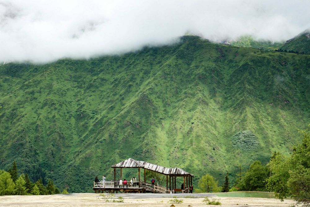 The photo was a little pavilion which was sitting on the edge of a deep valley behind it.