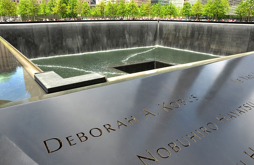 911 Memorial with reflection of the Freedom Tower - 1 World Trade ...