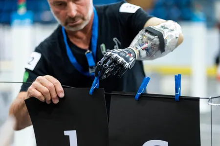 A man with a mind-controlled prosthetic competes in a test run of October's Cybathlon in Switzerland. 