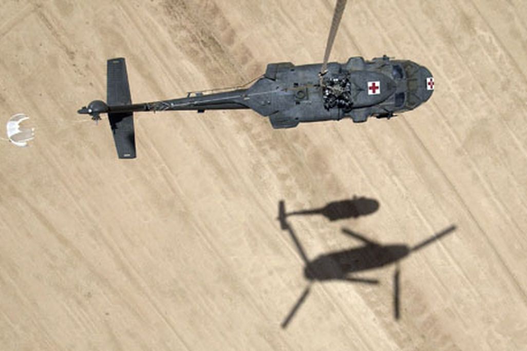 One helicopter helps another in Iraq.