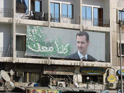 A poster for Syrian President Bashar al-Assad hangs in Damascus.