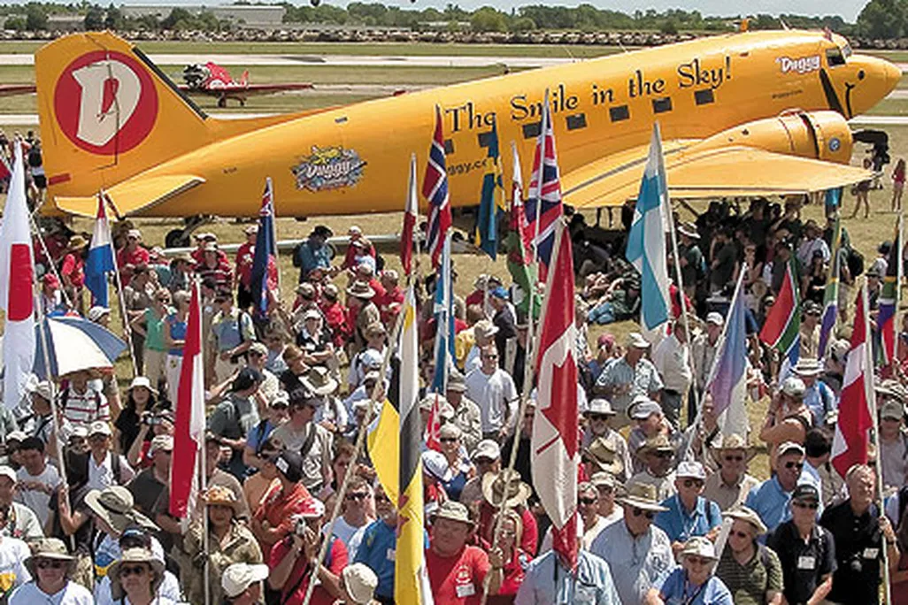 Two things you will find every July in Oshkosh Wisconsin The DC 3 Duggy and planeloads of international tourists