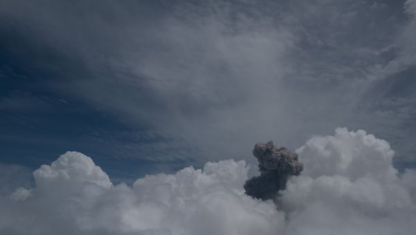 Volcanic smoke between clouds thumbnail