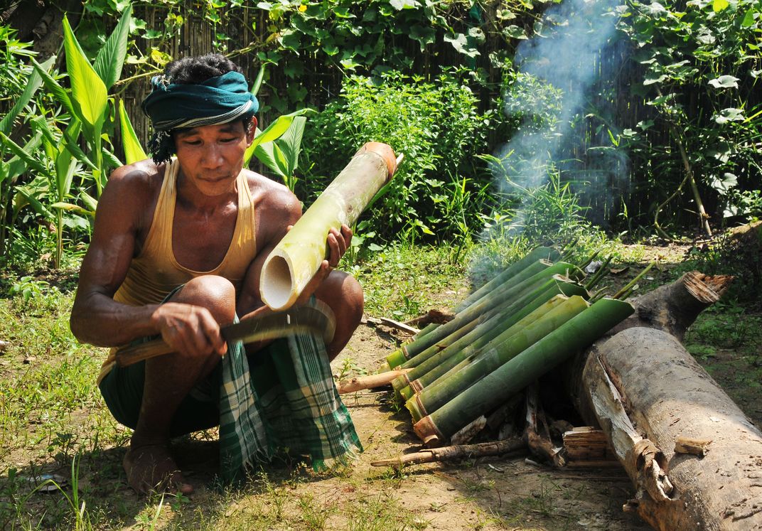 A karbi tribesman was cooking karbi ethnic cuisine in hemai lakthe ...