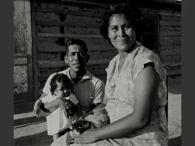 Patricia Stone (Akimel O'odham) and Leonard Stone (Akimel O'odham) with their new baby, 1965. Gila River Indian Community, Arizona.