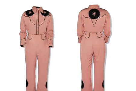 A western-style performance outfit worn by Patsy Cline and sewed by her mother. The suit features record-shaped patches stitched with the titles of some of Cline's records.


&nbsp;