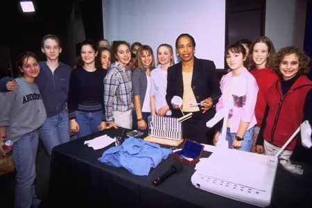 Ophthalmologist Dr. Patricia Bath poses with students at the National Museum of American History in 2000.