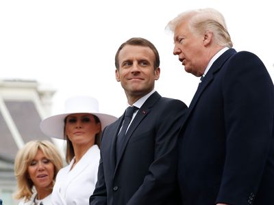 President Donald Trump, French President Emmanuel Macron, first lady Melania Trump, and Brigitte Macron stand during a State Arrival Ceremony on the South Lawn of the White House in Washington, Tuesday, April 24, 2018