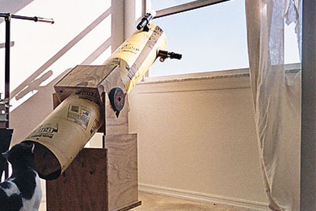 Still life with telescope, feline, and feet. Even the National Air and Space Museum uses a Dobsonian telescope to show visitors the sun.
