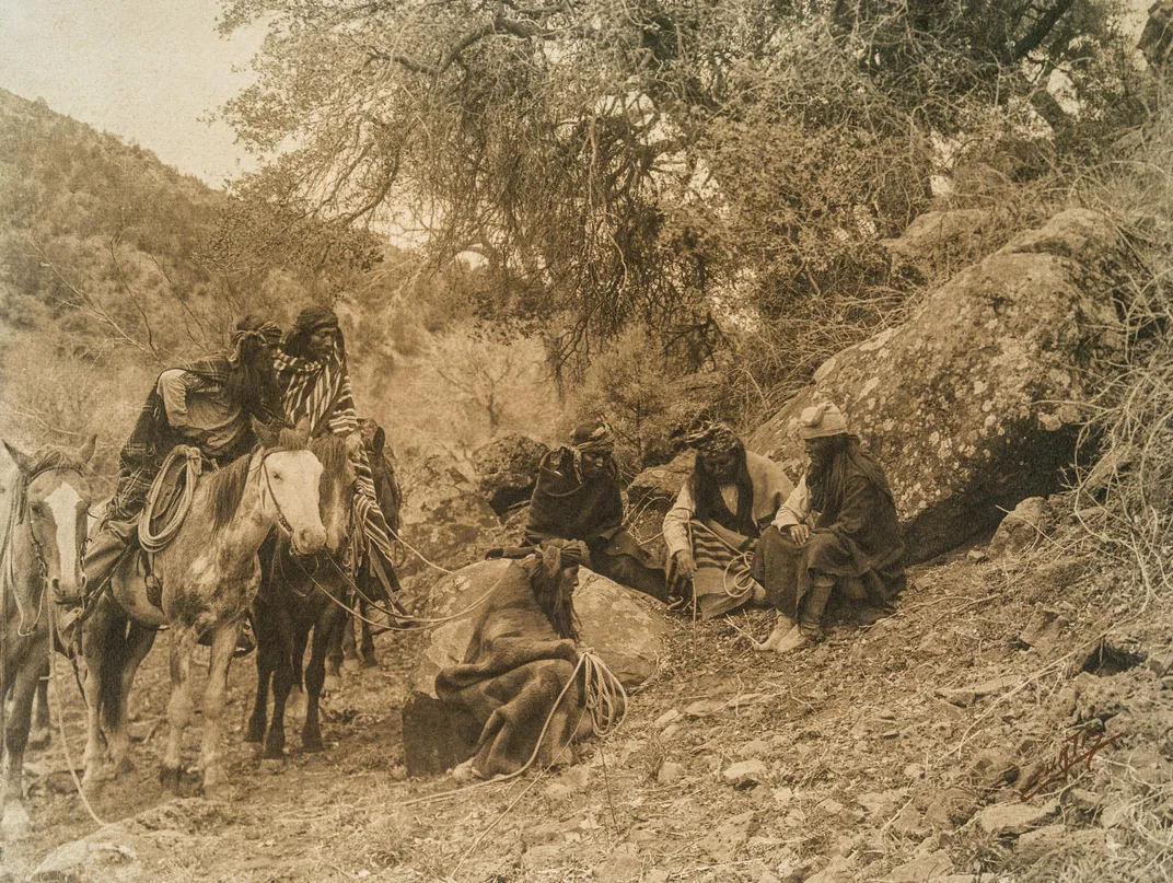White Mountain Apaches gather for storytelling in 1904