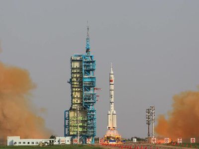 A Long March rocket lifts off with the Shenzhou-9 crew on board.
