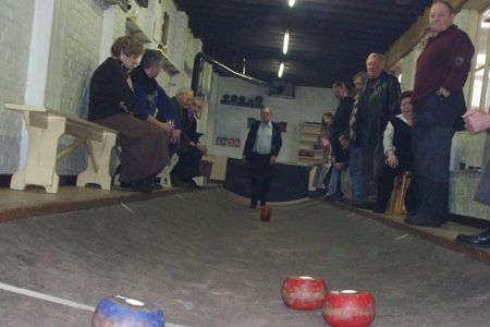 With the concave shape of the asphalt lanes, the path of the ball can be
unpredictable. Veteran players, however, have learned to use the physics of
the wheel-like disk and the curvature of the lane to their advantage.