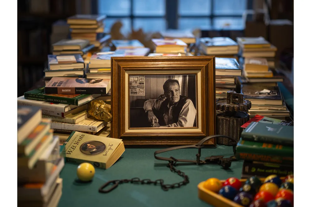 OPENER - In Cormac McCarthy’s living room, books jockey for space with a previously unpublished photo of the novelist, shot by his brother Dennis.