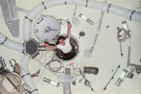 Edward G. Gibson, science pilot for Skylab 4, demonstrates zero-gravity as he floats through the airlock module hatch. About astronauts’ life in space, Raymond Loewy wrote, “Whether their experience will be one to which they wish to return, rich and rewarding, or a ghastly stretch in some cosmic Devil’s Island, is, in a large way, up to us all.” 