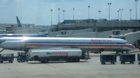A large passenger jet refueling. Such planes may consume five gallons of fuel per mile traveled. But is it possible that they’re more efficient than cars?