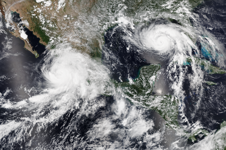 Hurricane Nora off the coast of Mexico and Hurricane Ida gaining strength in the Gulf of Mexico on&nbsp;August 28, 2021.