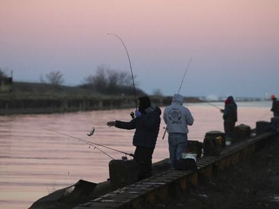 People in Chicago fishing on Lake Michigan on December 25, 2021. The new study found particularly high levels of PFAS in fish from the Great Lakes.
