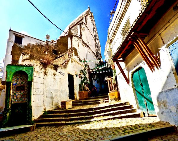 Tiled Water Fountain by an Old Winding Staircase of the  Algerian Casbah thumbnail