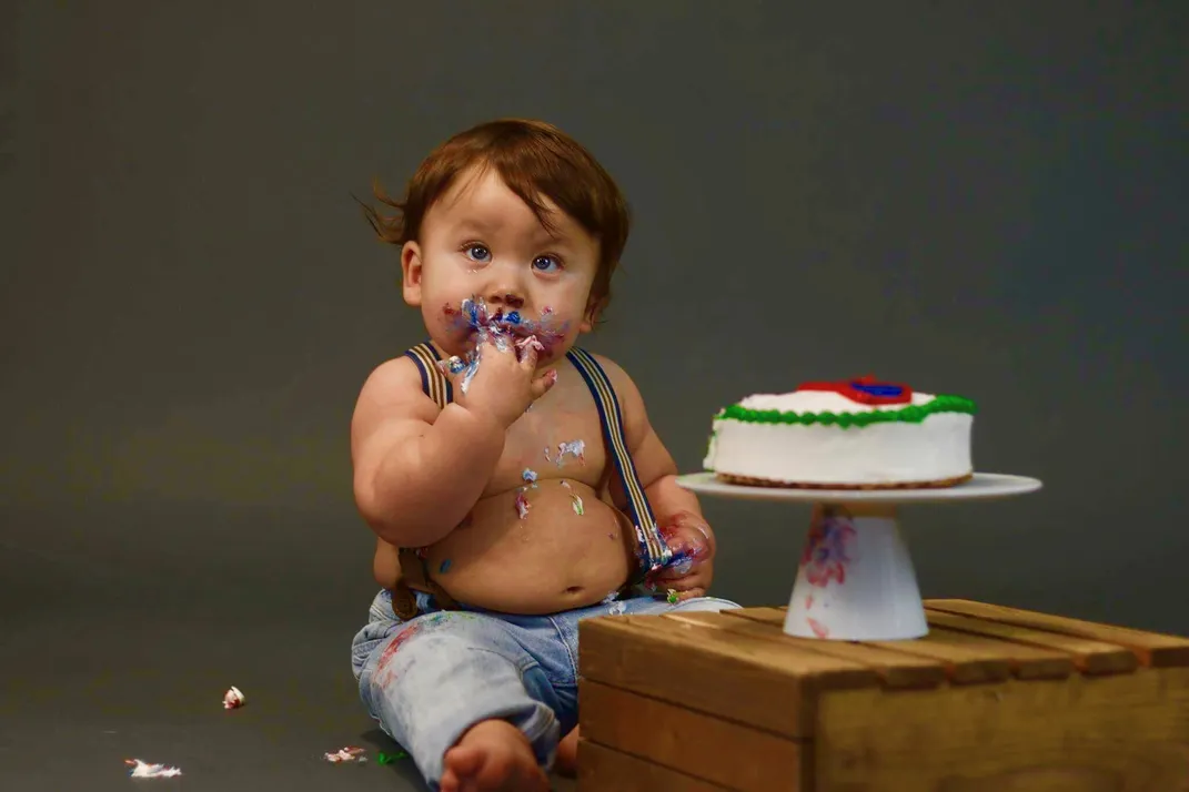 baby eating cake