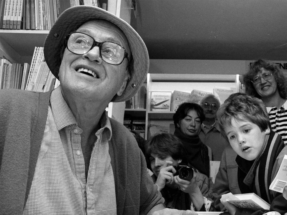 Roald Dahl signs books at a children's bookstore in Amsterdam in 1988