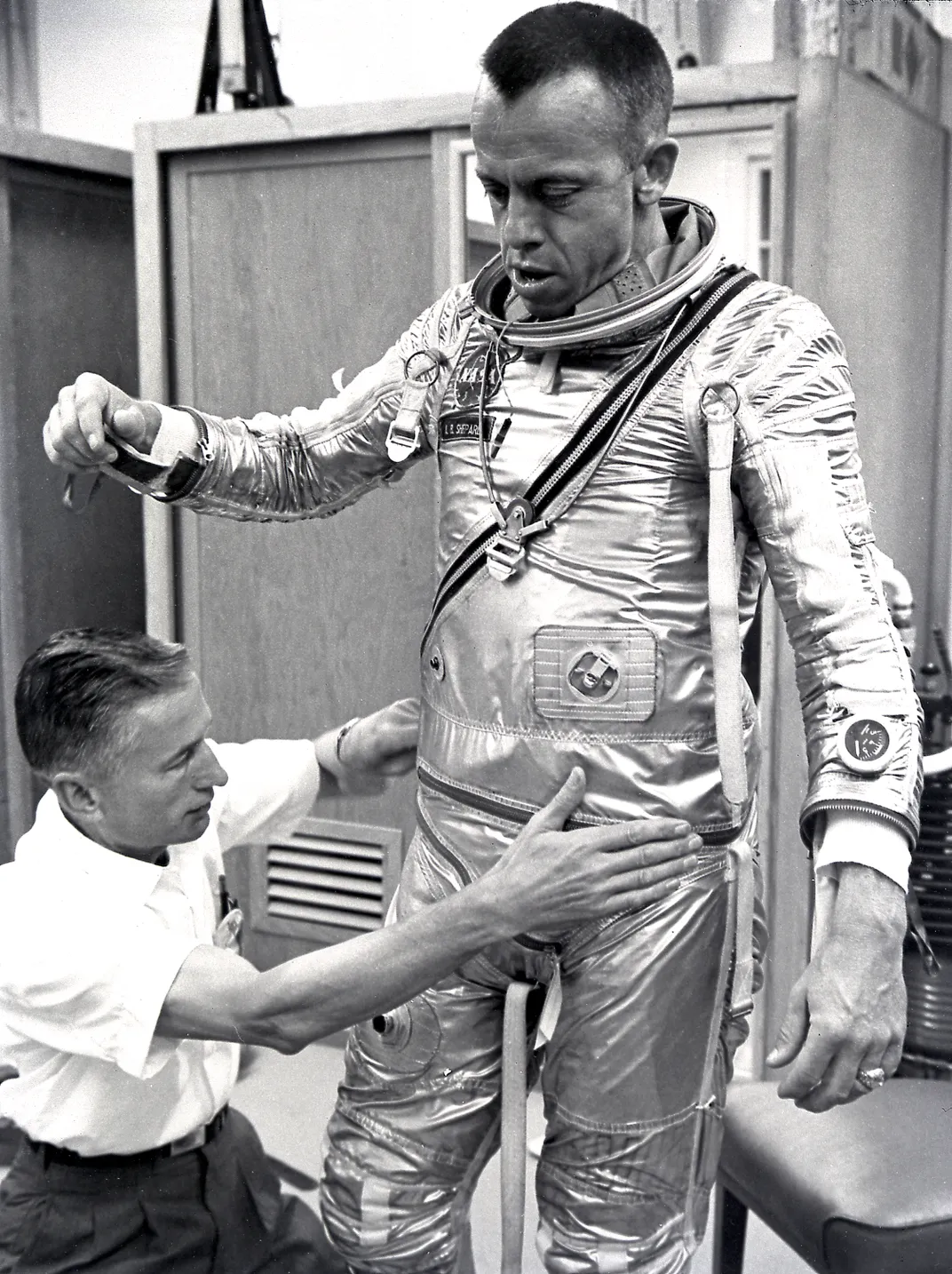Alan Shepard fitted into his space suit, May 5, 1961