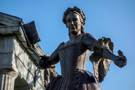 Bronze sculpture of Mercy Otis Warren stands in front of Barnstable County Courthouse, Massachusetts.