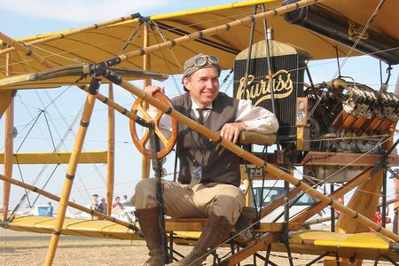 Dan Taylor dresses to suit a Curtiss Model D built by the late Cole Palen, curator of the Old Rhinebeck Aerodrome.